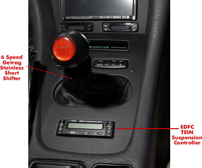 This shows the Stainless Steel short shifter for the 6 speed getrag transmission and the suspension controller for the TEIN coil over struts.